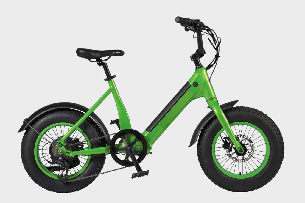 Side view of a green DAMAXED Electric Child's Bike, designed for various ages and packed with features.
