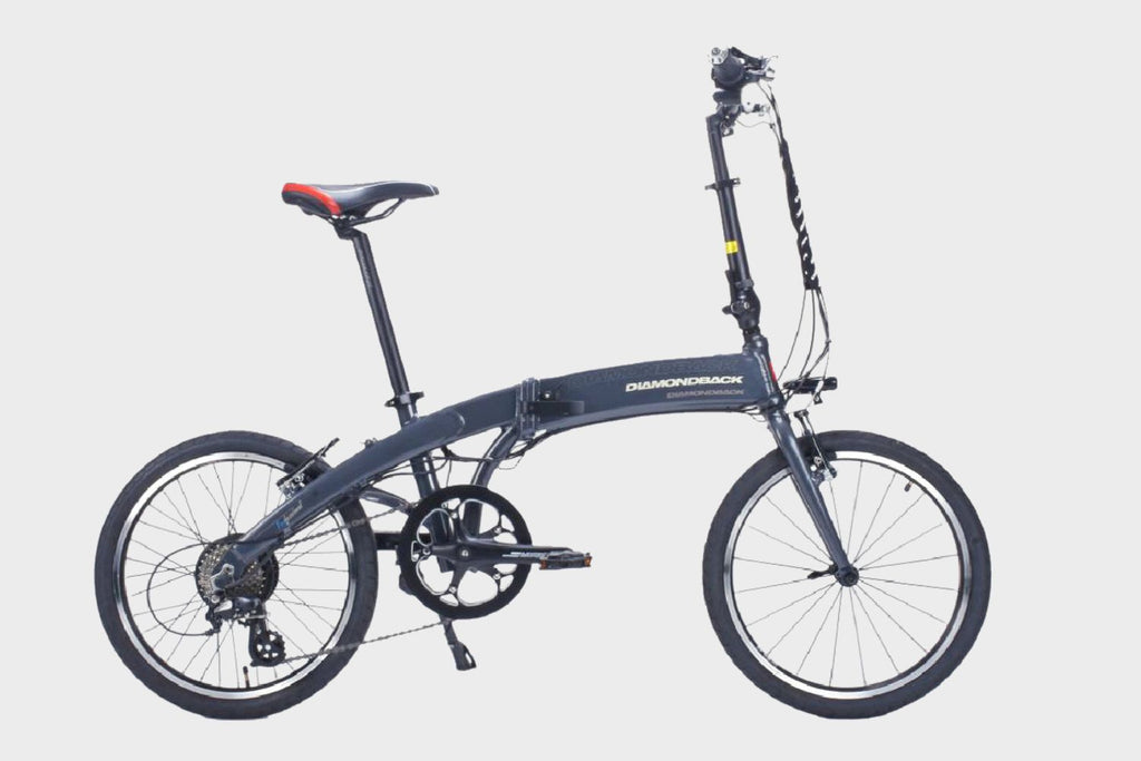 Black DAMAXED folding electric bicycle with compact design for easy storage and portability.