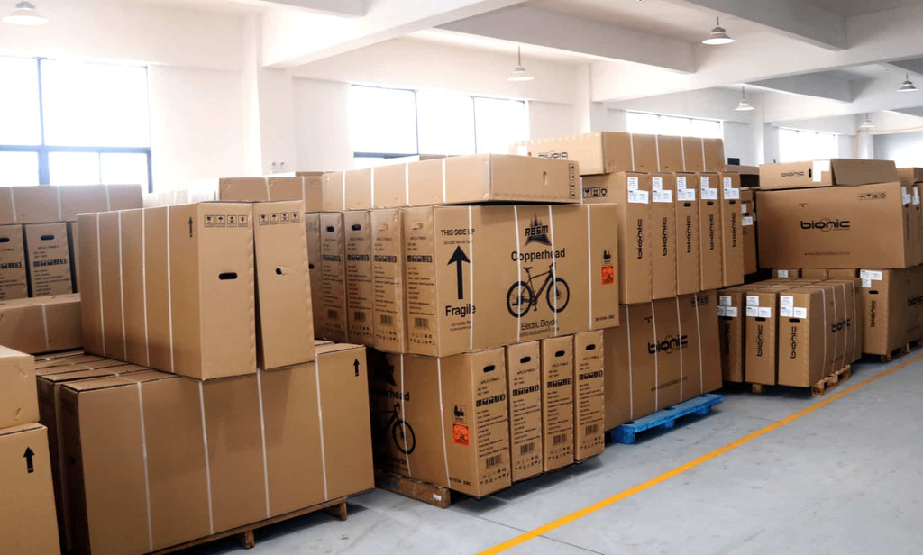 Assembled e-bikes, arranged neatly in DAMAXED warehouse, await transportation to the port for shipment.
