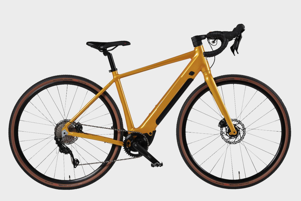 Side view of a yellow DAMAXED eGravel Electric Road Bike, featuring a sleek design and powerful electric capabilities.