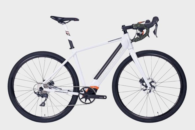 Side view of white DAMAXED electric road bike with angled handlebars and LCD display, perfect for long-distance rides.