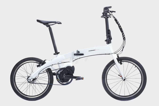 White DAMAXED folding electric bicycle with compact design for easy storage and portability.