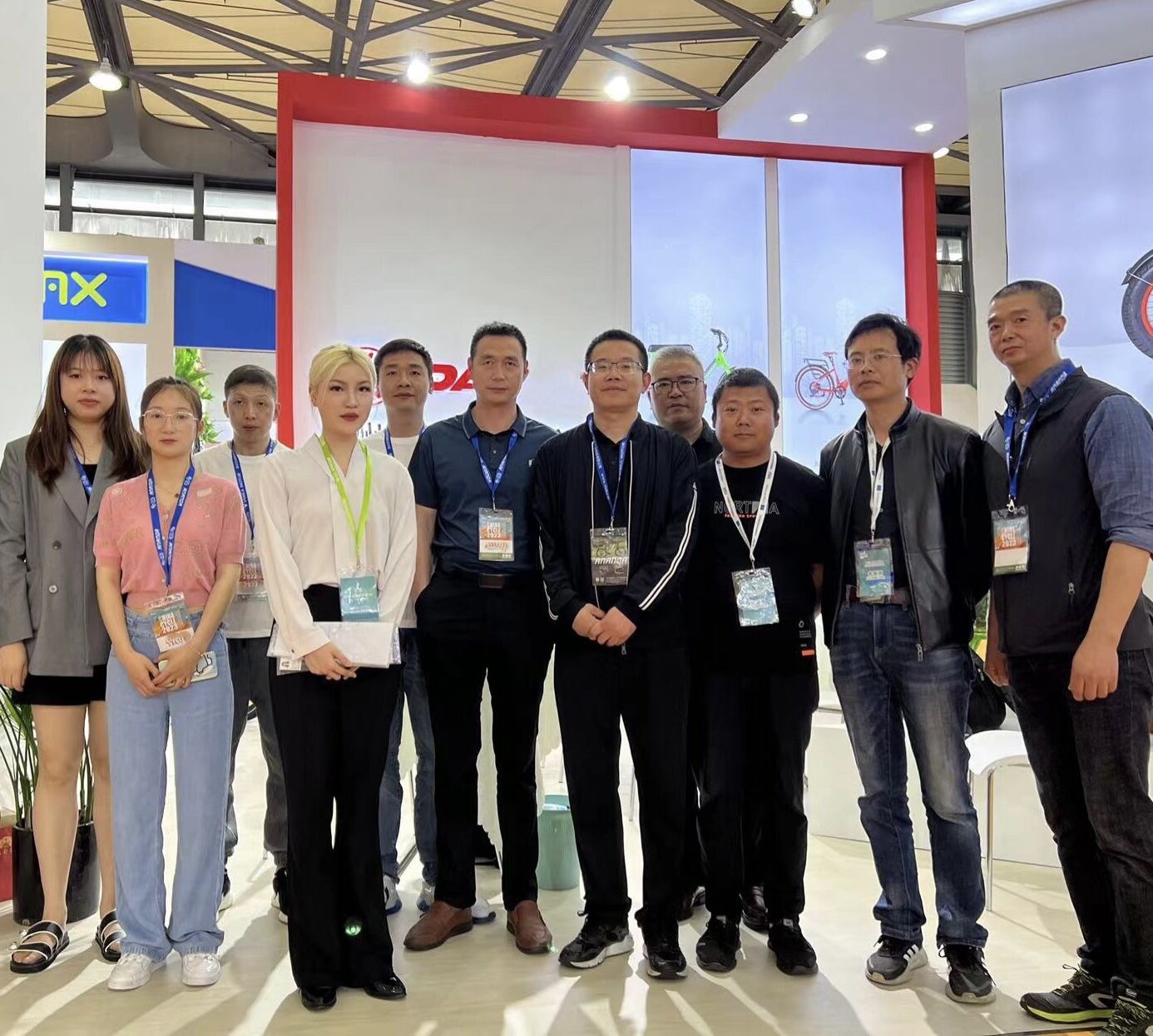 Damaxed ebike team posing at their booth during the 31st China International Bicycle Fair in Shanghai.