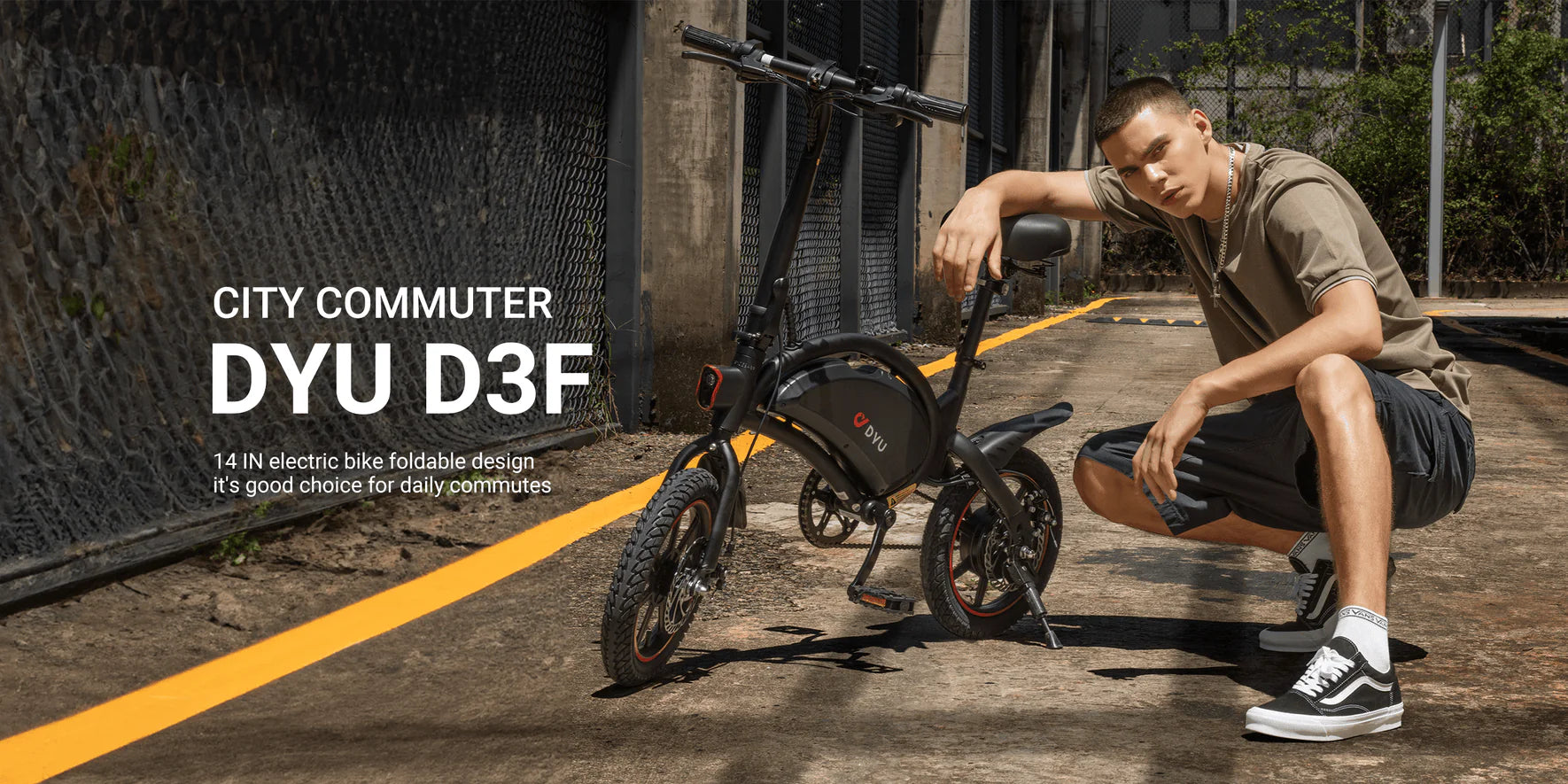 Person posing with a DYU D3 electric bike on a city street.